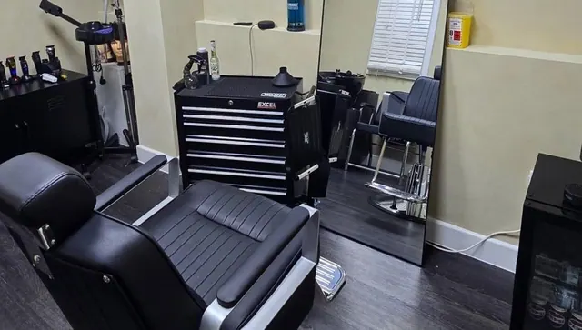 The studio: barber chairs and a tool chest by the window
